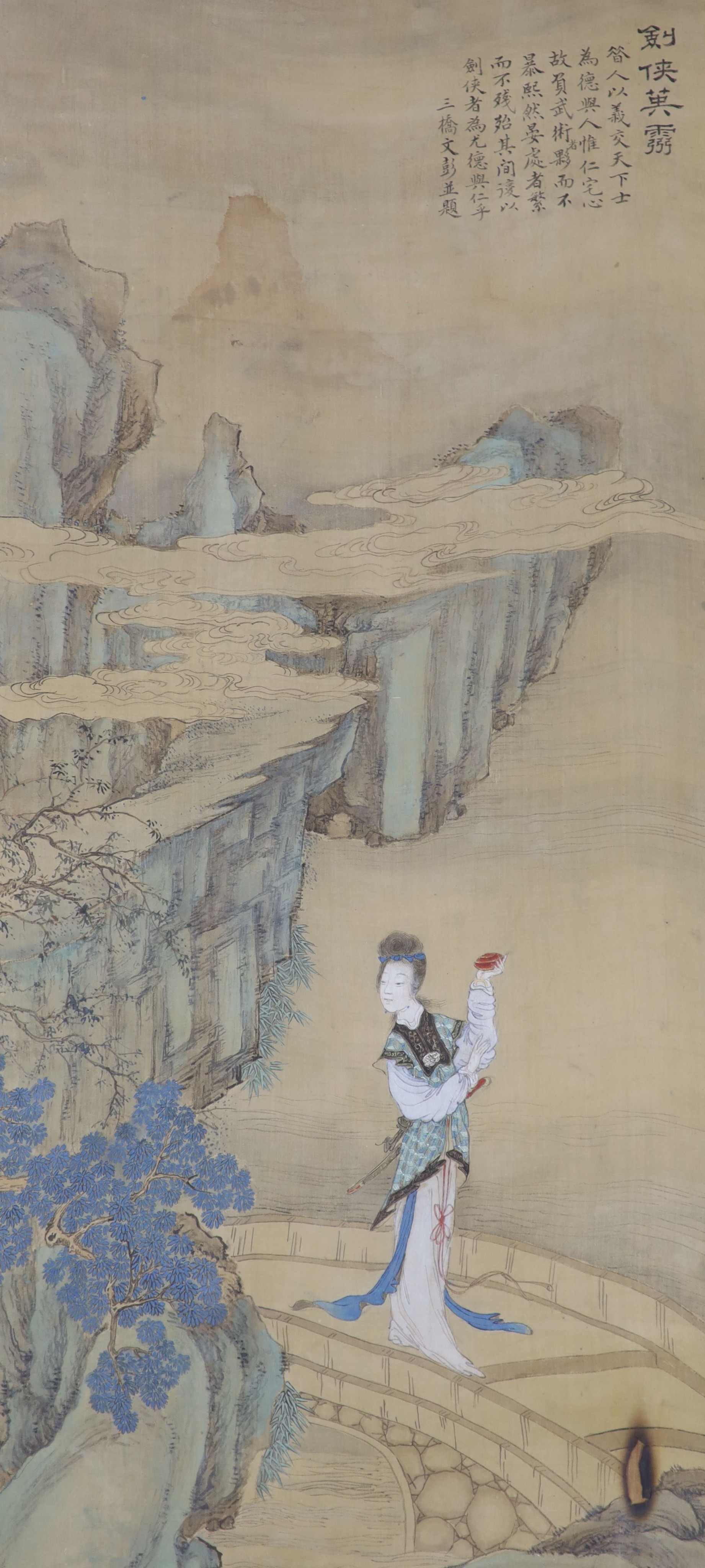 A large Chinese watercolour on silk, late 19th/early 20th century, woman in a landscape, signed, 91 x 42cm.